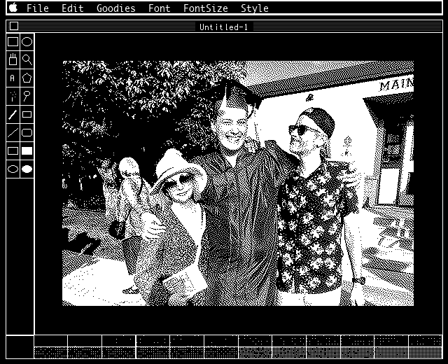 Justin Freeman with his wife and son, dithered and opened in MacPaint